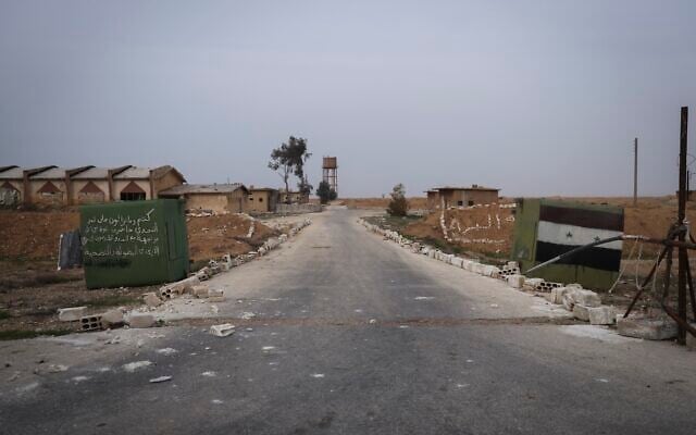 A Syrian army checkpoint stands abandoned near the Abu al-Duhur military airport, east of Idlib, after Syrian opposition fighters took control of the area on December 7, 2024. (AP/Omar Albam)