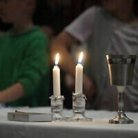 Illustrative: Congregants of the 104-year-old Pasadena Jewish Temple and Center which burned down in the Eaton fire, gather for Shabbat dinner at the First United Methodist Church in Pasadena, Calif., April 4, 2025. (AP Photo/Damian Dovarganes)