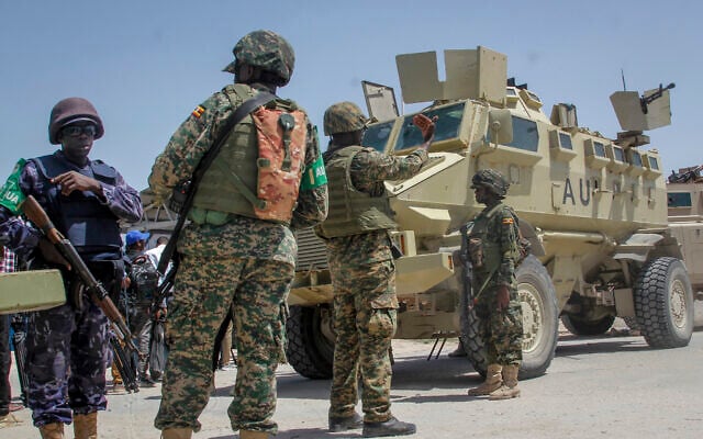 African Union peacekeepers from Uganda provide security as Somali lawmakers arrive to cast their vote in the presidential election, at the Halane military camp in Mogadishu, Somalia May 15, 2022. (AP Photo/Farah Abdi Warsameh)