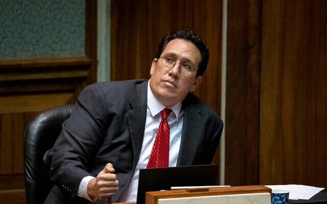 Democratic State Sen. Jarrett Keohokalole, watches a colleague speak during a floor session at the State Capitol, April 30, 2025, in Honolulu, Hawaii. (AP Photo/Mengshin Lin)