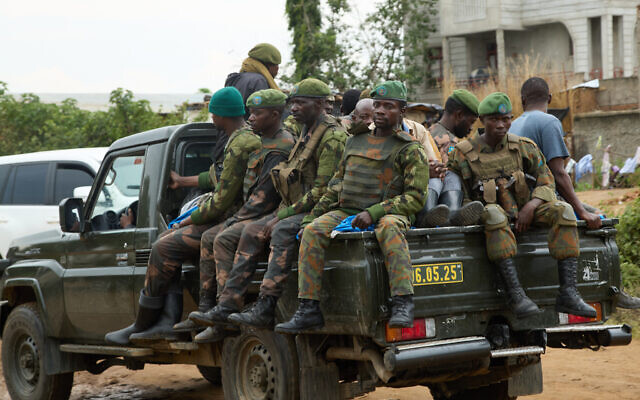Soldiers patrol as thousands of people fleeing fighting in Congo’s South Kivu province arrive in Cibitoke, Kansega, Burundi, December 11, 2025. (AP/Berthier Mugiraneza)
