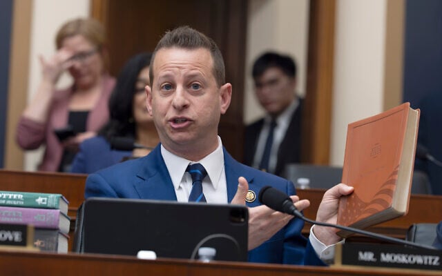Rep. Jared Moskowitz, D-Fla., holds up a Trump Bible as he questions Attorney General Pam Bondi in the House Judiciary Committee at the Capitol in Washington, February 11, 2026. (AP Photo/J. Scott Applewhite)