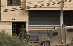 File: Israeli soldiers enter a house during a military raid in the West Bank village of al-Yamun, near Jenin, February 17, 2026. (AP Photo/Leo Correa)