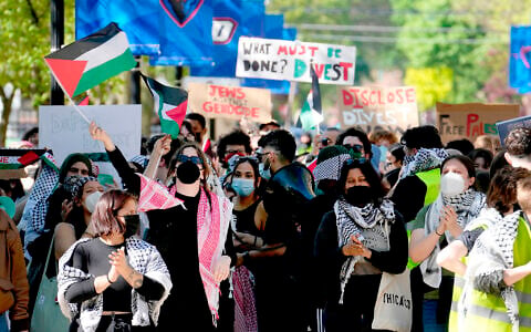 Pro-Palestinian protesters demonstrate on the campus of DePaul University, April 30, 2024, in Chicago. (AP Photo/Charles Rex Arbogast)