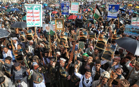 Houthi supporters raise their leader Abdul Malik al-Houthi posters during a rally titled, “denouncing the Zionist criminal Trump’s insult toward Mecca” in Sanaa, Yemen, June 16, 2026. (AP Photo/Osamah Abdulrahman)
