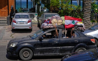 A displaced family with their belongings, wave a Lebanese flag as they return to their village, following a ceasefire between Israel and Hezbollah in the southern port city of Sidon, Lebanon, June 23, 2026. (AP Photo/Mohammed Zaatari) A displaced family with their belongings, wave a Lebanese flag as they return to their village, following a ceasefire between Israel and Hezbollah in the southern port city of Sidon, Lebanon, June 23, 2026. (AP Photo/Mohammed Zaatari)