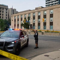 Police work the scene of an early morning shooting outside the US Consulate in Toronto, on July 27, 2026. (Sammy Kogan/The Canadian Press via AP)