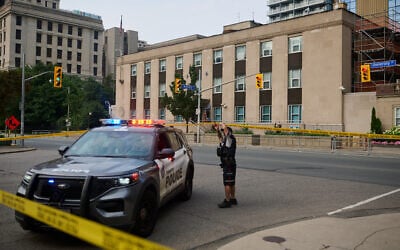 Police work the scene of an early morning shooting outside the US Consulate in Toronto, on July 27, 2026. (Sammy Kogan/The Canadian Press via AP)