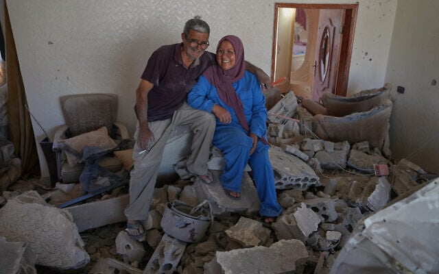 Mahasen Faqih and her husband, Mohammed Sobeih, smile as they sit amid the rubble of their home after returning to it following a ceasefire in Zawtar al-Gharbieh, Lebanon, July 28, 2026. (AP/Hassan Ammar) Mahasen Faqih and her husband, Mohammed Sobeih, smile as they sit amid the rubble of their home after returning to it following a ceasefire in Zawtar al-Gharbieh, Lebanon, July 28, 2026. (AP/Hassan Ammar)