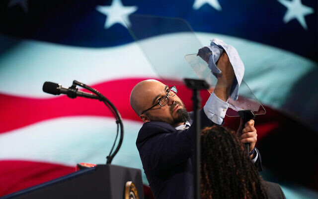 Gabriel Perez cleans the teleprompter before President Donald Trump speaks at the Future Investment Initiative Institute’s summit, March 27, 2026, in Miami Beach, Florida (AP Photo/Mark Schiefelbein) Gabriel Perez cleans the teleprompter before President Donald Trump speaks at the Future Investment Initiative Institute’s summit, March 27, 2026, in Miami Beach, Florida (AP Photo/Mark Schiefelbein)