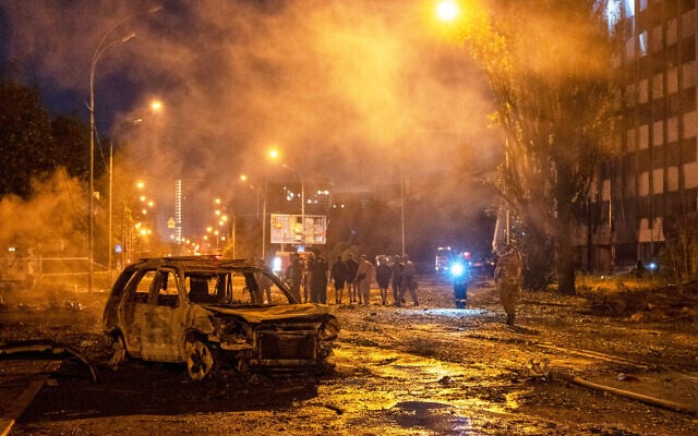 A burned car is seen after a Russian missile attack in Kyiv, Ukraine, August 1, 2026. (AP Photo/Dan Bashakov)