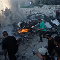 Palestinians respond at the site of an Israeli military strike in Gaza City, August 2, 2026. (AP Photo/Jehad Alshrafi)