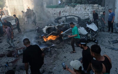Palestinians respond at the site of an Israeli military strike in Gaza City, August 2, 2026. (AP Photo/Jehad Alshrafi)