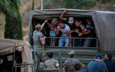 Migrants who crossed into Spain are escorted by Spanish soldiers towards the Spanish-Moroccan border for their return to Morocco from the Spanish enclave of Ceuta, August 2, 2026. (AP Photo/Antonio Sempere) Migrants who crossed into Spain are escorted by Spanish soldiers towards the Spanish-Moroccan border for their return to Morocco from the Spanish enclave of Ceuta, August 2, 2026. (AP Photo/Antonio Sempere)