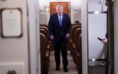 US President Donald Trump walks to speak to reporters onboard Air Force One while returning to the White House, August 2, 2026. (AP Photo/Jacquelyn Martin)