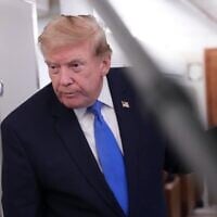 US President Donald Trump speaks to reporters onboard Air Force One while returning to the White House, August 2, 2026. (AP Photo/Jacquelyn Martin)