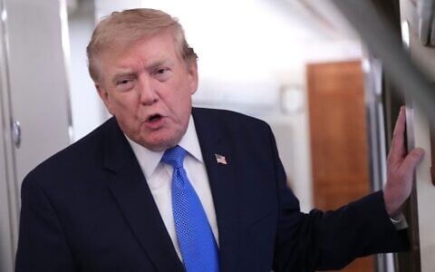 US President Donald Trump speaks to reporters onboard Air Force One while returning to the White House, August 2, 2026. (AP Photo/Jacquelyn Martin)