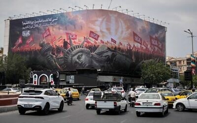 A billboard depicting a fallen Statue of Liberty and crowds carrying Iranian and Shiite flags overlooks Revolution Square as traffic drives by in Tehran, Iran, August 3, 2026. (AP Photo/Vahid Salemi) A billboard depicting a fallen Statue of Liberty and crowds carrying Iranian and Shiite flags overlooks Revolution Square as traffic drives by in Tehran, Iran, August 3, 2026. (AP Photo/Vahid Salemi)