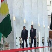 Syrian President Ahmad al-Sharaa, right, walks with Kurdistan Region President Nechirvan Barzani during a meeting at the People’s Palace in Damascus, Syria, August 3, 2026. (AP Photo/Ghaith Alsayed)