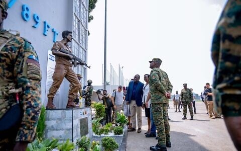 Uganda’s military chief, Gen. Muhoozi Kainerugaba unveils a monument honoring the late Yoni Netanyahu, brother of Prime Minister Benjamin Netanyahu, at the old terminal of Entebbe International Airport in Entebbe, Uganda, August 1, 2026. (Uganda People’s Defence Forces Press Service via AP)