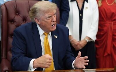 US President Donald Trump gestures as he speaks in the Oval Office of the White House, August 3, 2026, in Washington. (AP/Alex Brandon)