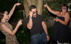 Abdul El-Sayed, a progressive, anti-Israel candidate in the Democratic primary for US Senate in Michigan, films a social media video at a pool party for content creators supporting his campaign, August 3, 2026, in Detroit. (AP/Julia Demaree Nikhinson)