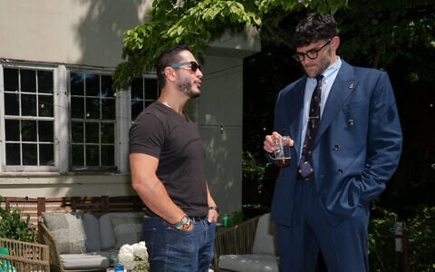 Abdul El-Sayed, a progressive candidate in the Democratic primary for US Senate in Michigan, talks poolside with streamer Hasan Piker at a party for content creators supporting his campaign, August 3, 2026, in Detroit. (AP Photo/Julia Demaree Nikhinson)