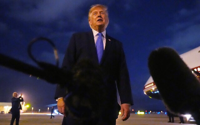 US President Donald Trump talks to reporters before he boards Air Force One, August 4, 2026, at Los Angeles International Airport in Los Angeles. (AP/Mark Schiefelbein)