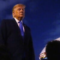 US President Donald Trump talks to reporters before he boards Air Force One, August 4, 2026, at Los Angeles International Airport in Los Angeles. (AP Photo/Mark Schiefelbein)
