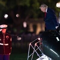 US President Donald Trump steps off from Marine One upon his arrival at the Ellipse just outside of the White House, August 5, 2026, in Washington. (AP Photo/Jose Luis Magana)