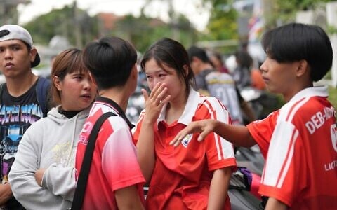 A schoolgirl cries outside her school where deaths and injuries were reported after a shooting in Thailand’s Nonthaburi province, August 7, 2026. (AP/Sakchai Lalit)