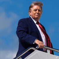 US President Donald Trump boards Air Force One at Joint Base Andrews in Maryland on August 7, 2026. (AP Photo/Julia Demaree Nikhinson)
