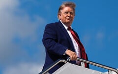 US President Donald Trump boards Air Force One at Joint Base Andrews in Maryland on August 7, 2026. (AP Photo/Julia Demaree Nikhinson)