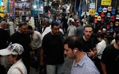 People walk in Tehran’s traditional main bazaar, Iran, August 8, 2026. (AP Photo/Vahid Salemi)