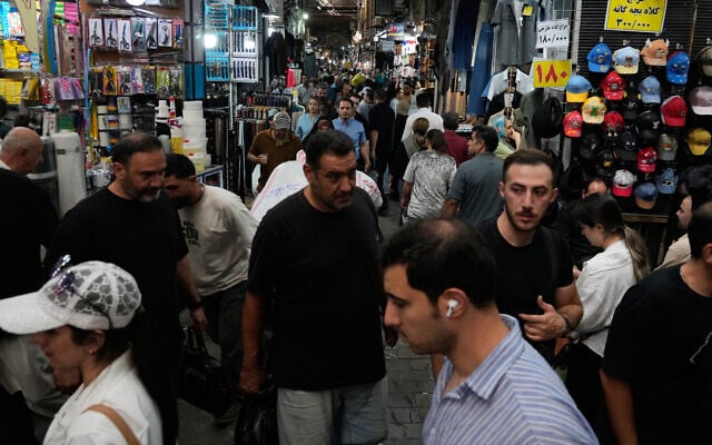 People walk in Tehran’s traditional main bazaar, Iran, August 8, 2026. (AP Photo/Vahid Salemi)