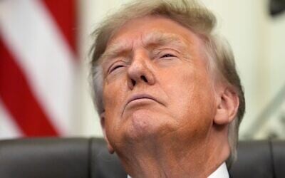 US President Donald Trump attends a meeting to sign an executive order about vaccines, August 10, 2026, in the Oval Office of the White House in Washington. (AP Photo/ Jacquelyn Martin)