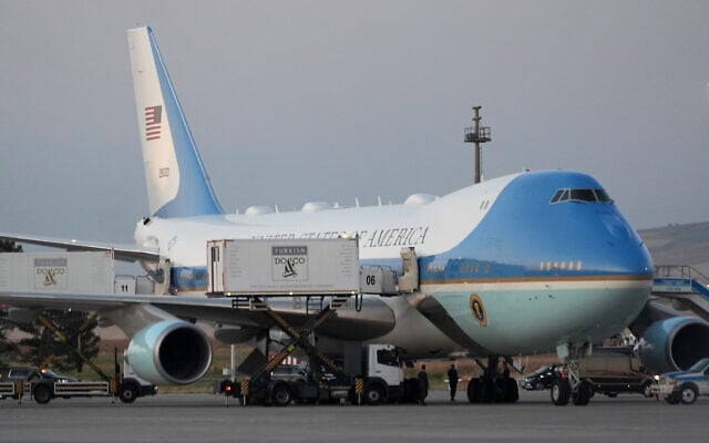 Catering trucks are parked at Air Force One on the tarmac as the motorcade carrying US President Donald Trump arrives on the tarmac to depart following the NATO summit at Ankara International Airport in Ankara, Turkey, July 8, 2026. (AP Photo/Alex Brandon)
