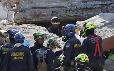 Rescue workers search through the rubble of a collapsed building the day after an earthquake struck Cali, Colombia, August 11, 2026. (AP Photo/Santiago Saldarriaga) Rescue workers search through the rubble of a collapsed building the day after an earthquake struck Cali, Colombia, August 11, 2026. (AP Photo/Santiago Saldarriaga)