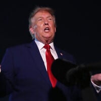 President Donald Trump talks to reporters after arriving on Air Force One, August 11, 2026, at Joint Base Andrews, Md. (AP Photo/Mark Schiefelbein)