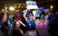 Supporters react to election results coming in during a primary election night watch party for Democratic gubernatorial candidate David Crowley, August 11, 2026, in Milwaukee, Wis. (AP Photo/Kayla Wolf)