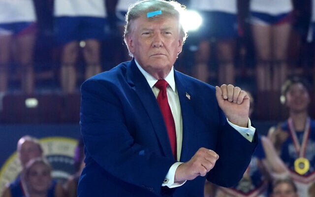 US President Donald Trump attends the Patriot Games at Spire Academy in Geneva, Ohio, August 11, 2026. (AP Photo/Mark Schiefelbein)