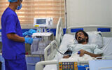 Pakistani crew member Zaheer Ahmed, right, receives medical treatment at 2 December Hospital in Mokha, Yemen, on August 12, 2026, after the cargo ship Tihama was struck in a Houthi attack in the Bab al-Mandab Strait off Yemen’s Dhubab district on August 10, 2026. (AP Photo/Abdulnasser Alseddik)