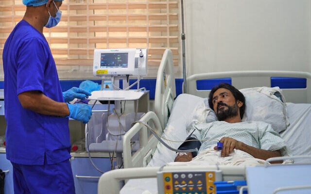 Pakistani crew member Zaheer Ahmed, right, receives medical treatment at 2 December Hospital in Mokha, Yemen, on August 12, 2026, after the cargo ship Tihama was struck in a Houthi attack in the Bab al-Mandab Strait off Yemen’s Dhubab district on August 10, 2026. (AP Photo/Abdulnasser Alseddik)