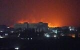 Flames and smoke rise from the port of Mokha during a strike in Yemen, August 14, 2026. (AP/Photo/Abdulnasser Alseddik)