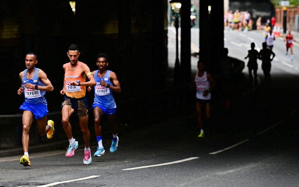 From left, Israel’s Maru Teferi, Spain’s Ilias Fifa and Israel’s Gashau Ayale compete in the men’s marathon during the European Athletics Championships in Birmingham, England, August 16, 2026. (Ben Stansall/Pool via AP)