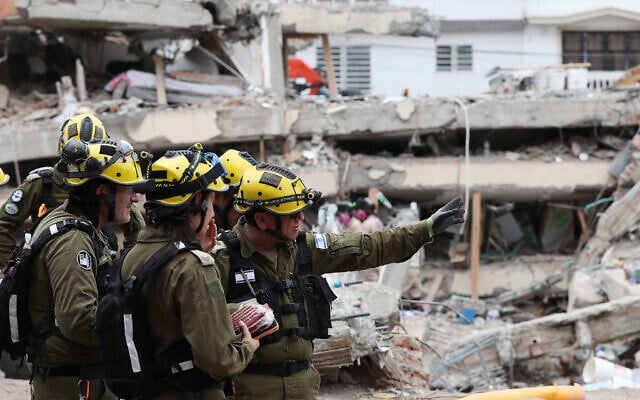 Members of an Israeli search-and-rescue team assess earthquake damage in Cali, Colombia, August 16, 2026. (AP/Santiago Saldarriaga)