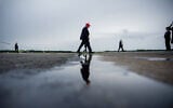 US President Donald Trump walks to board Air Force One at Morristown Airport, August 16, 2026, in Morristown, New Jersey. (AP Photo/Julia Demaree Nikhinson)