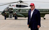 US President Donald Trump yells to reporters after disembarking Air Force One, August 16, 2026, at Joint Base Andrews, Maryland. (AP/Julia Demaree Nikhinson)