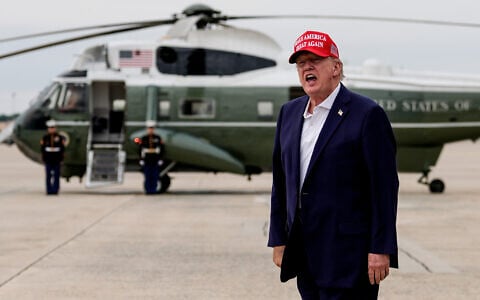 US President Donald Trump yells to reporters after disembarking Air Force One, August 16, 2026, at Joint Base Andrews, Maryland. (AP/Julia Demaree Nikhinson)