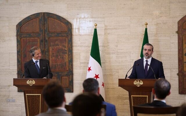 International Atomic Energy Agency’s director-general Rafael Mariano Grossi, left, and Syrian Foreign Minister Asaad al-Shibani attend a press conference in Damascus, Syria, August 18, 2026. (AP Photo/Ghaith Alsayed)
